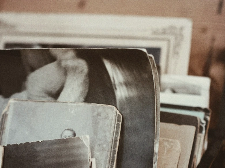 old photos in brown wooden chest