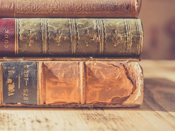 shallow focus photography of stack of books